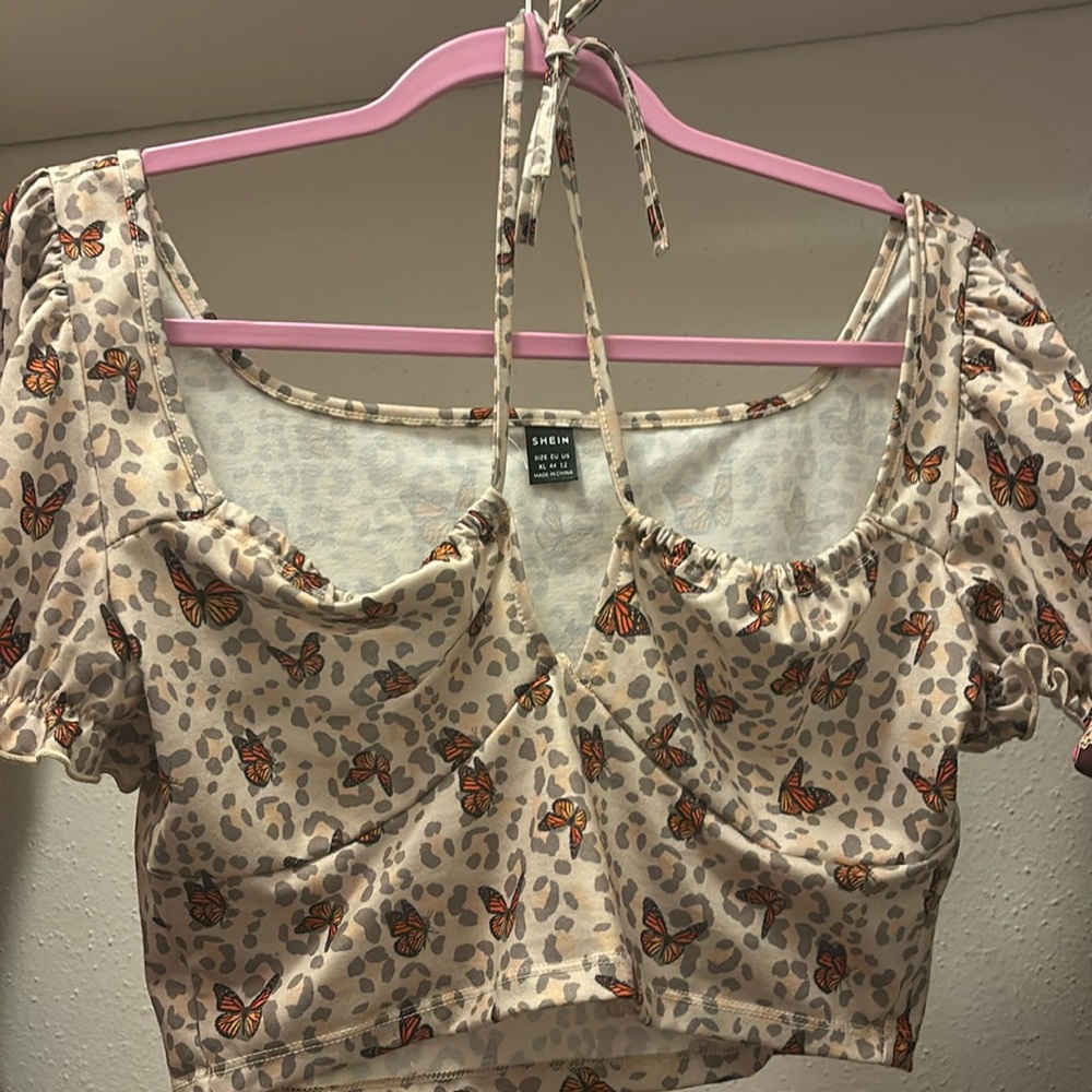 XL crop top that ties at the top by SHEIN. With butterfly design.